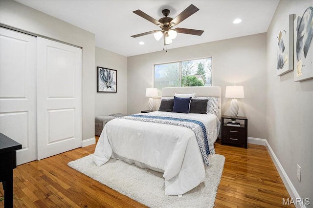 4501 Conleth Dr, Saint Louis, MO 63129 - bedroom featuring wood finished floors, a closet, baseboards, recessed lighting, and a ceiling fan