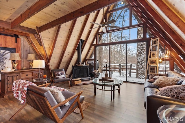 353 Seebrook Lake Dr, Wright City, MO 63390 - living room featuring a wood stove, wood finished floors, wooden ceiling, wood walls, and ceiling fan