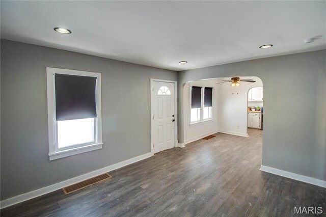 330 Grant St, Bethalto, IL 62010 - foyer entrance with arched walkways, baseboards, dark wood-type flooring, recessed lighting, and ceiling fan