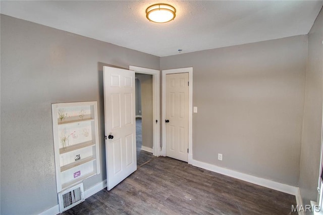 330 Grant St, Bethalto, IL 62010 - unfurnished bedroom with baseboards and wood finished floors
