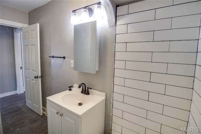 330 Grant St, Bethalto, IL 62010 - bathroom with wood finished floors, vanity, and baseboards