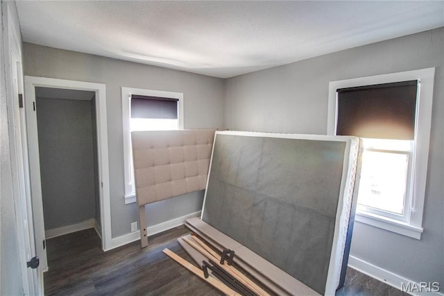 330 Grant St, Bethalto, IL 62010 - unfurnished bedroom with wood finished floors and baseboards