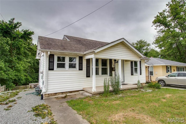 330 Grant St, Bethalto, IL 62010 - view of front of home with covered porch and roof with shingles
