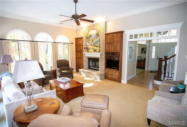 14342 N 1025th St, Effingham, IL 62401 - living room with crown molding, a ceiling fan, a brick fireplace, light colored carpet, and baseboards