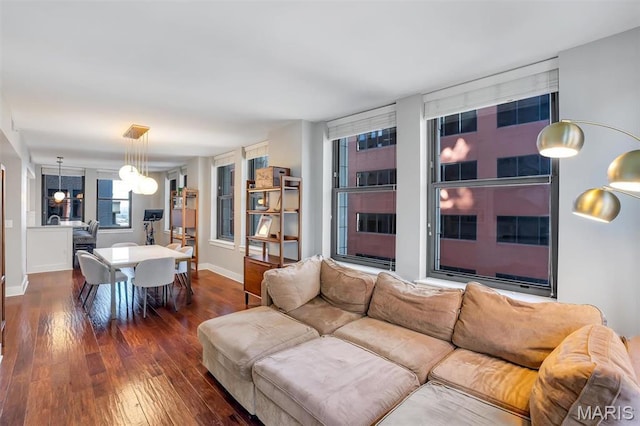 314 N Broadway Unit 903, Saint Louis, MO 63102 - living area with hardwood / wood-style floors, a chandelier, and baseboards