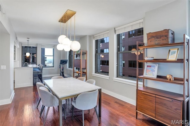 314 N Broadway Unit 903, Saint Louis, MO 63102 - dining space featuring baseboards and wood finished floors