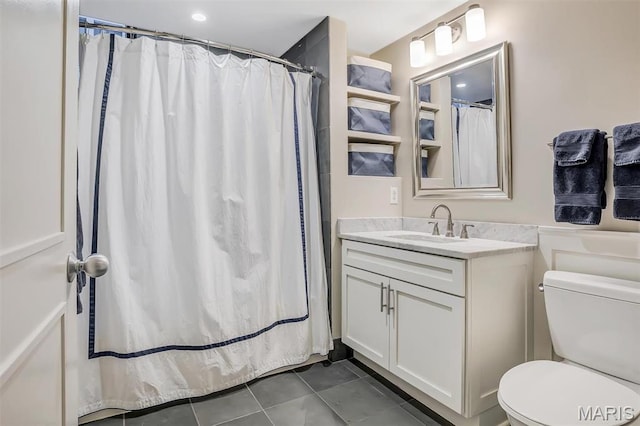 314 N Broadway Unit 903, Saint Louis, MO 63102 - bathroom with vanity, toilet, tile patterned floors, and a shower with shower curtain