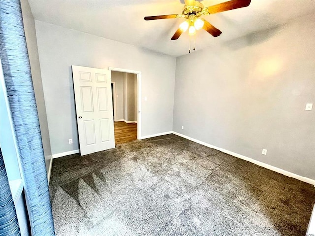307 E Grant St, Belleville, IL 62220 - unfurnished room featuring dark colored carpet, ceiling fan, and baseboards