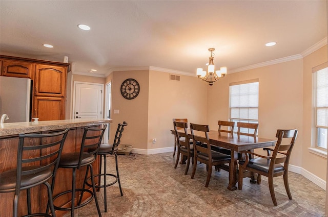 450 Worth St, Holts Summit, MO 65043 - dining space with a chandelier, healthy amount of natural light, baseboards, ornamental molding, and recessed lighting
