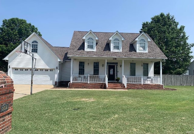902 S Sutton Pl, Kennett, MO 63857 - cape cod home with a porch, driveway, an attached garage, and a shingled roof