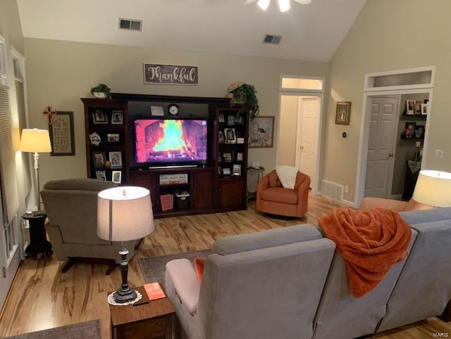 902 S Sutton Pl, Kennett, MO 63857 - living room with wood finished floors, lofted ceiling, ceiling fan, and baseboards