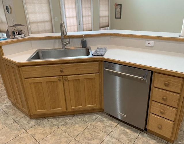902 S Sutton Pl, Kennett, MO 63857 - kitchen with dishwasher, a sink, light tile patterned floors, and light countertops