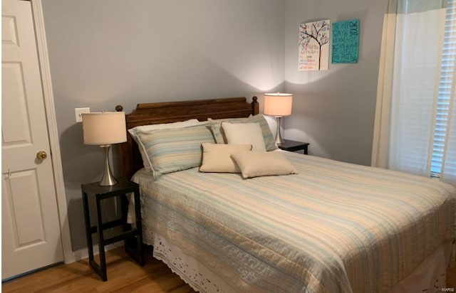 902 S Sutton Pl, Kennett, MO 63857 - bedroom featuring wood finished floors