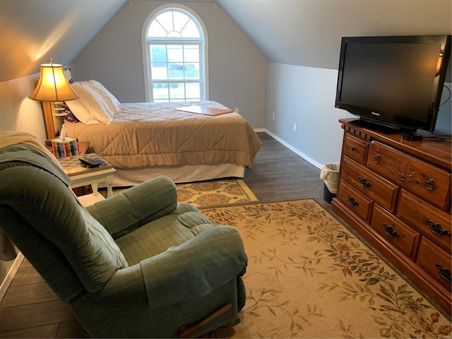 902 S Sutton Pl, Kennett, MO 63857 - bedroom featuring dark wood-style flooring, baseboards, and lofted ceiling