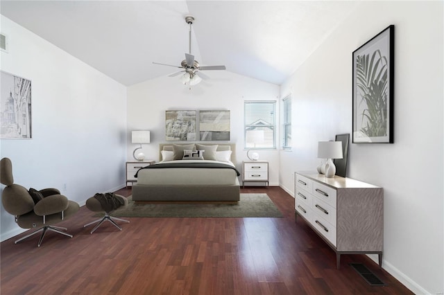 bedroom featuring lofted ceiling, dark wood-style floors, baseboards, and a ceiling fan