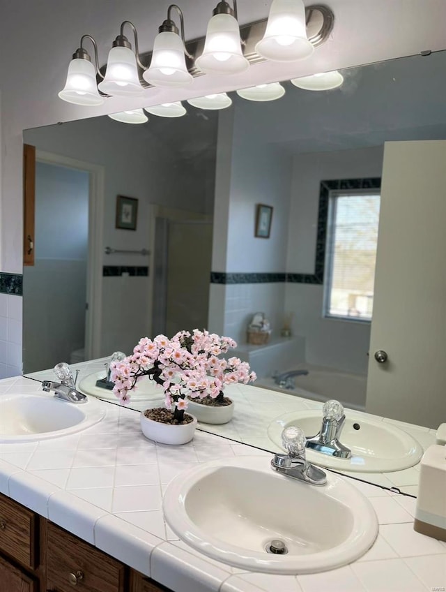full bath with double vanity and a garden tub