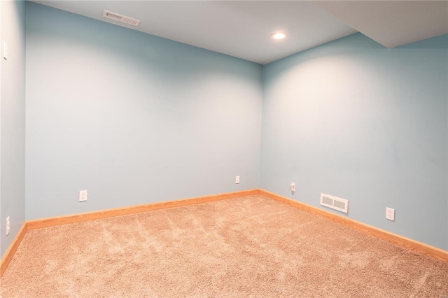 spare room featuring baseboards, carpet, and recessed lighting