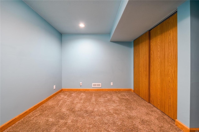 finished basement with carpet flooring, baseboards, and recessed lighting