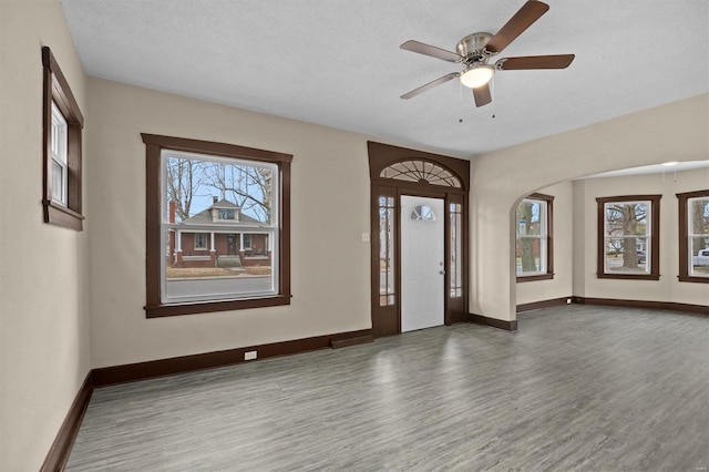811 Lebanon Ave, Belleville, IL 62221 - entryway with wood finished floors, baseboards, ceiling fan, a textured ceiling, and arched walkways