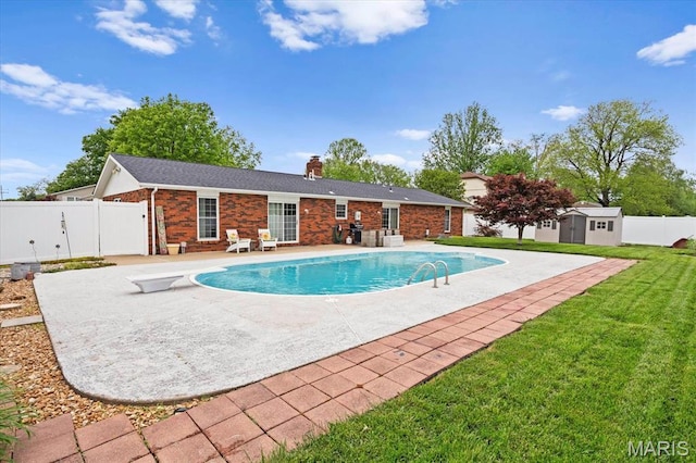 800 N Smiley St, Ofallon, IL 62269 - view of pool featuring a patio area, a storage shed, an outbuilding, and a diving board