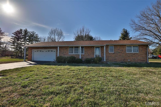ranch-style house with a garage, concrete driveway, a front lawn, and brick siding