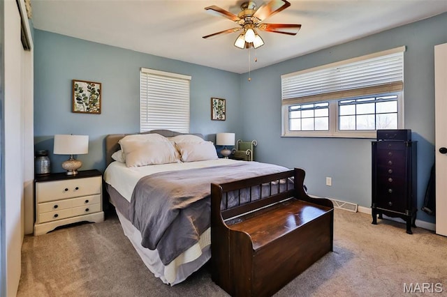 bedroom featuring carpet floors, baseboards, and a ceiling fan
