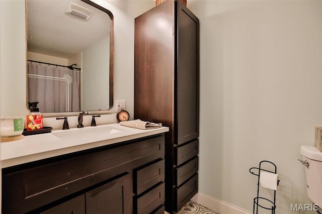 full bathroom with vanity and toilet