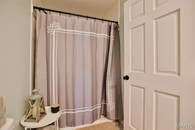 bathroom with a shower with shower curtain