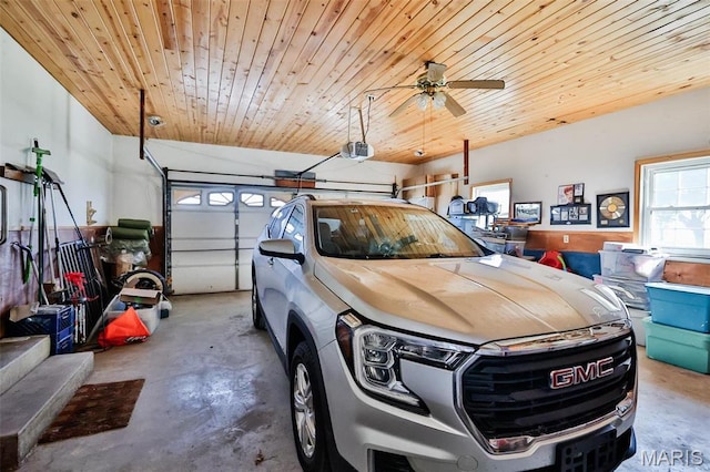 garage featuring wood ceiling and ceiling fan