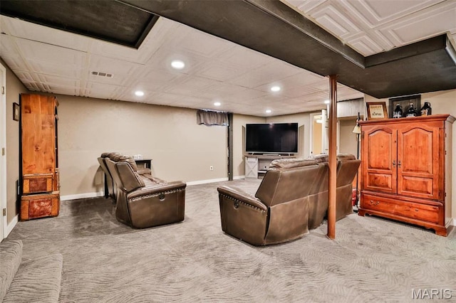 living room featuring carpet floors, baseboards, and recessed lighting