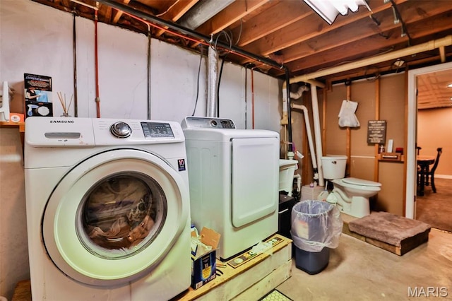 laundry area with washing machine and dryer