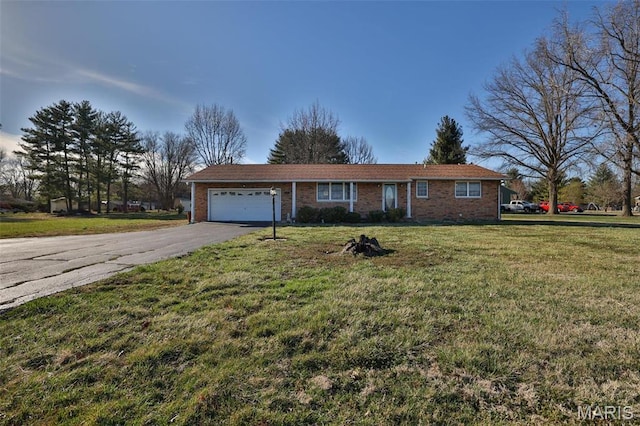 single story home with an attached garage, asphalt driveway, brick siding, and a front lawn
