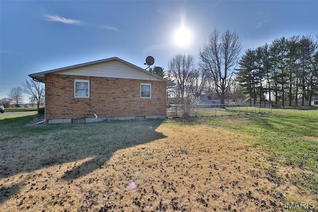view of home's exterior with brick siding