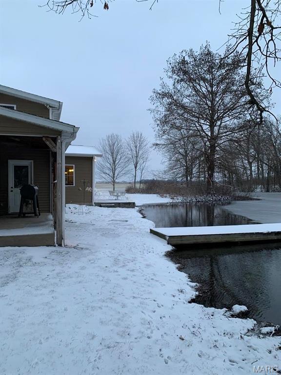view of yard layered in snow