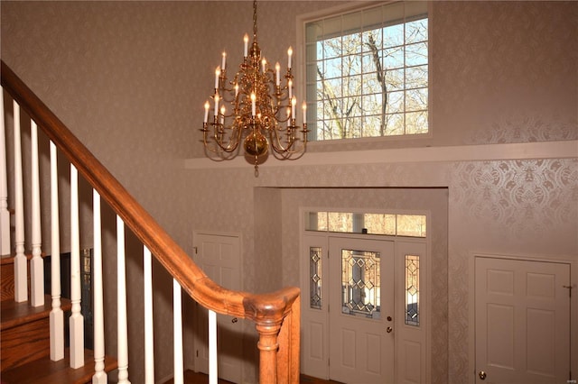 821 Oak Knoll Rd, Rolla, MO 65401 - foyer entrance with a high ceiling, a chandelier, and stairway