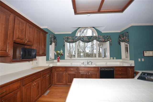 821 Oak Knoll Rd, Rolla, MO 65401 - kitchen with black appliances, a sink, light wood-type flooring, ornamental molding, and brown cabinetry