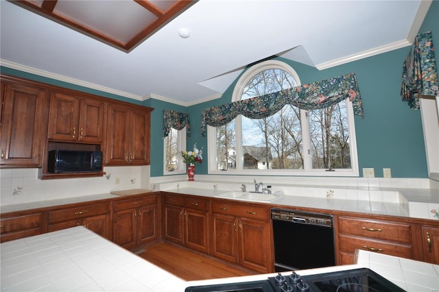 821 Oak Knoll Rd, Rolla, MO 65401 - kitchen featuring black appliances, a sink, tile countertops, crown molding, and decorative backsplash