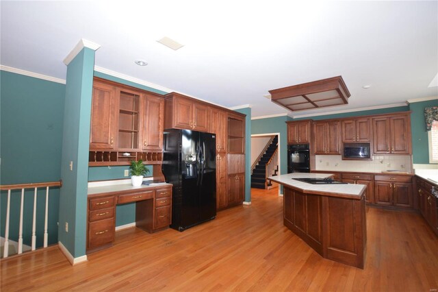 821 Oak Knoll Rd, Rolla, MO 65401 - kitchen featuring black appliances, light countertops, ornamental molding, open shelves, and a kitchen island