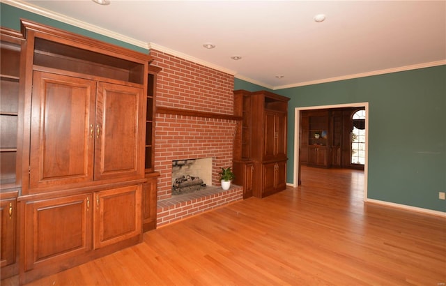 821 Oak Knoll Rd, Rolla, MO 65401 - unfurnished living room with light wood finished floors, crown molding, baseboards, and a brick fireplace