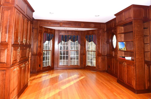 821 Oak Knoll Rd, Rolla, MO 65401 - entryway with light wood-style flooring, wooden walls, and recessed lighting