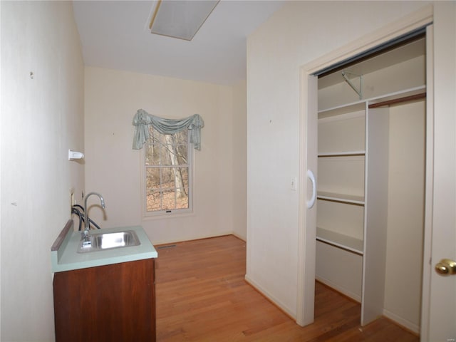821 Oak Knoll Rd, Rolla, MO 65401 - bathroom with a sink and wood finished floors