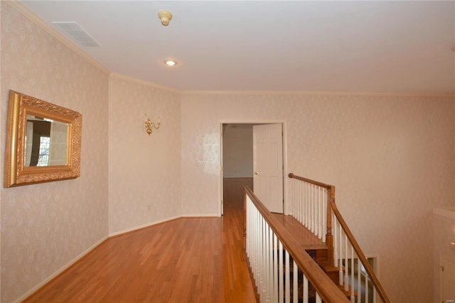 821 Oak Knoll Rd, Rolla, MO 65401 - hallway featuring an upstairs landing, wood finished floors, crown molding, and baseboards