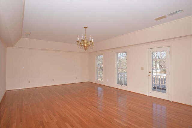 821 Oak Knoll Rd, Rolla, MO 65401 - spare room featuring light wood-style floors, a chandelier, and baseboards