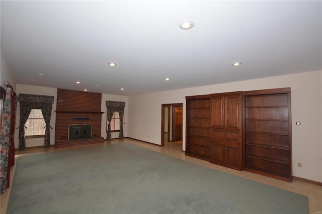 821 Oak Knoll Rd, Rolla, MO 65401 - unfurnished living room featuring a fireplace, baseboards, and recessed lighting