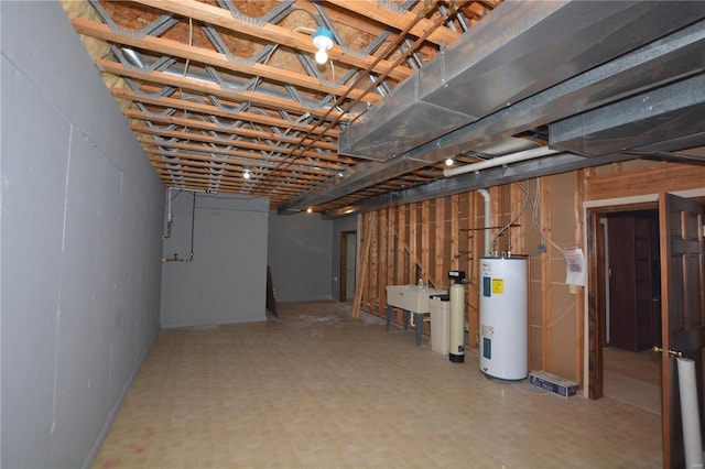 821 Oak Knoll Rd, Rolla, MO 65401 - unfinished basement featuring electric water heater, tile patterned floors, and a sink