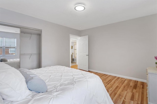 1418 Bluebird Ter, Saint Louis, MO 63144 - bedroom with light wood-type flooring, a closet, and baseboards
