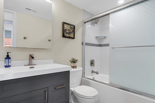 1418 Bluebird Ter, Saint Louis, MO 63144 - bathroom with toilet, vanity, and bath / shower combo with glass door