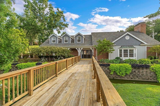 1418 Bluebird Ter, Saint Louis, MO 63144 - view of front of property with board and batten siding, a shingled roof, brick siding, and a chimney