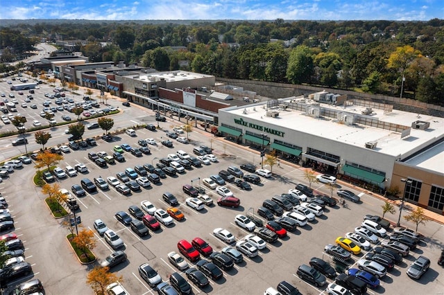 1418 Bluebird Ter, Saint Louis, MO 63144 - drone / aerial view of a commercial area and a heavily wooded area