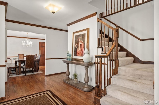 1578 Mason Knoll Rd, Town And Country, MO 63131 - entryway featuring stairs, a chandelier, crown molding, wood finished floors, and baseboards